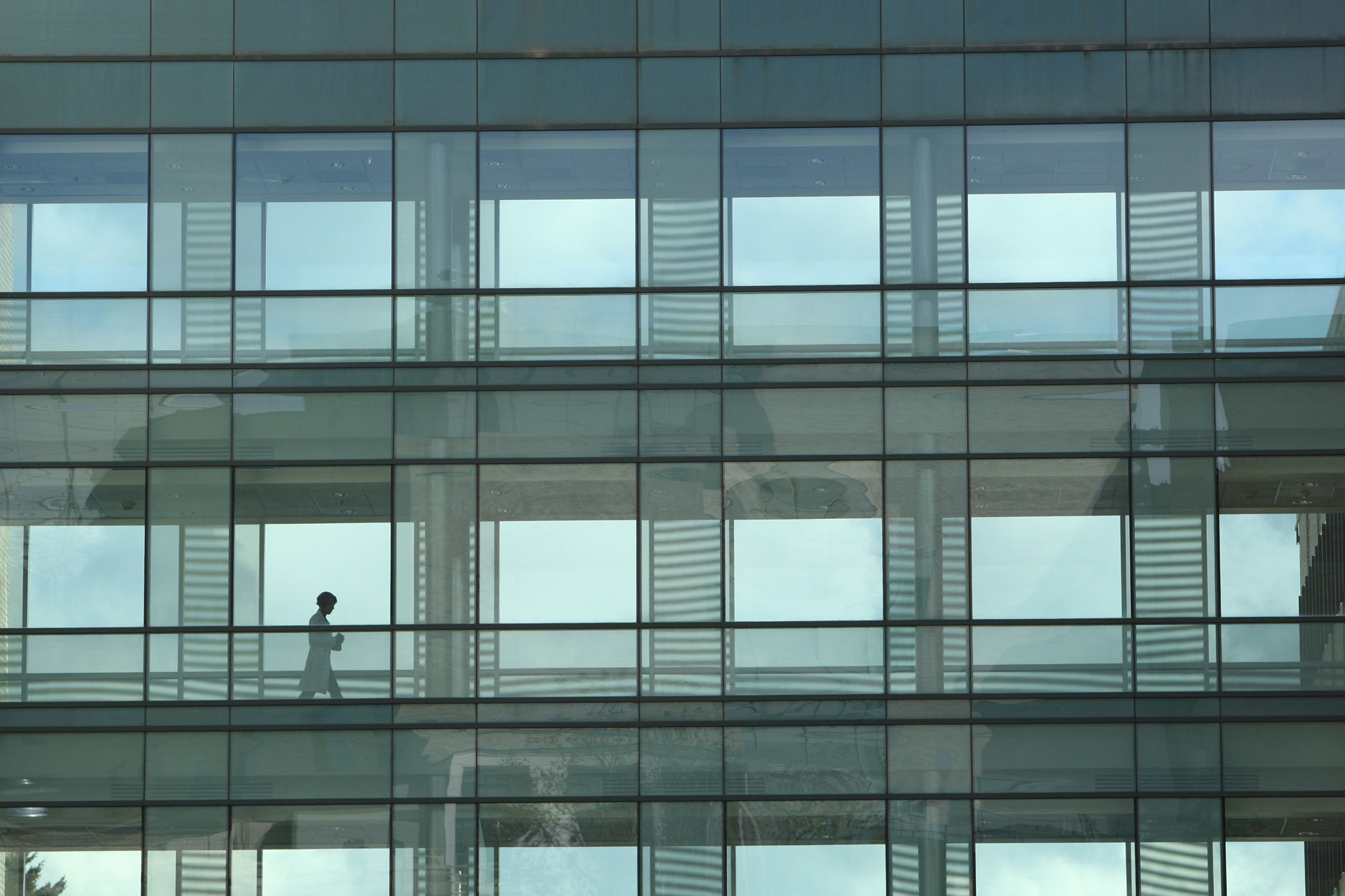 A person walking across the BICC bridge