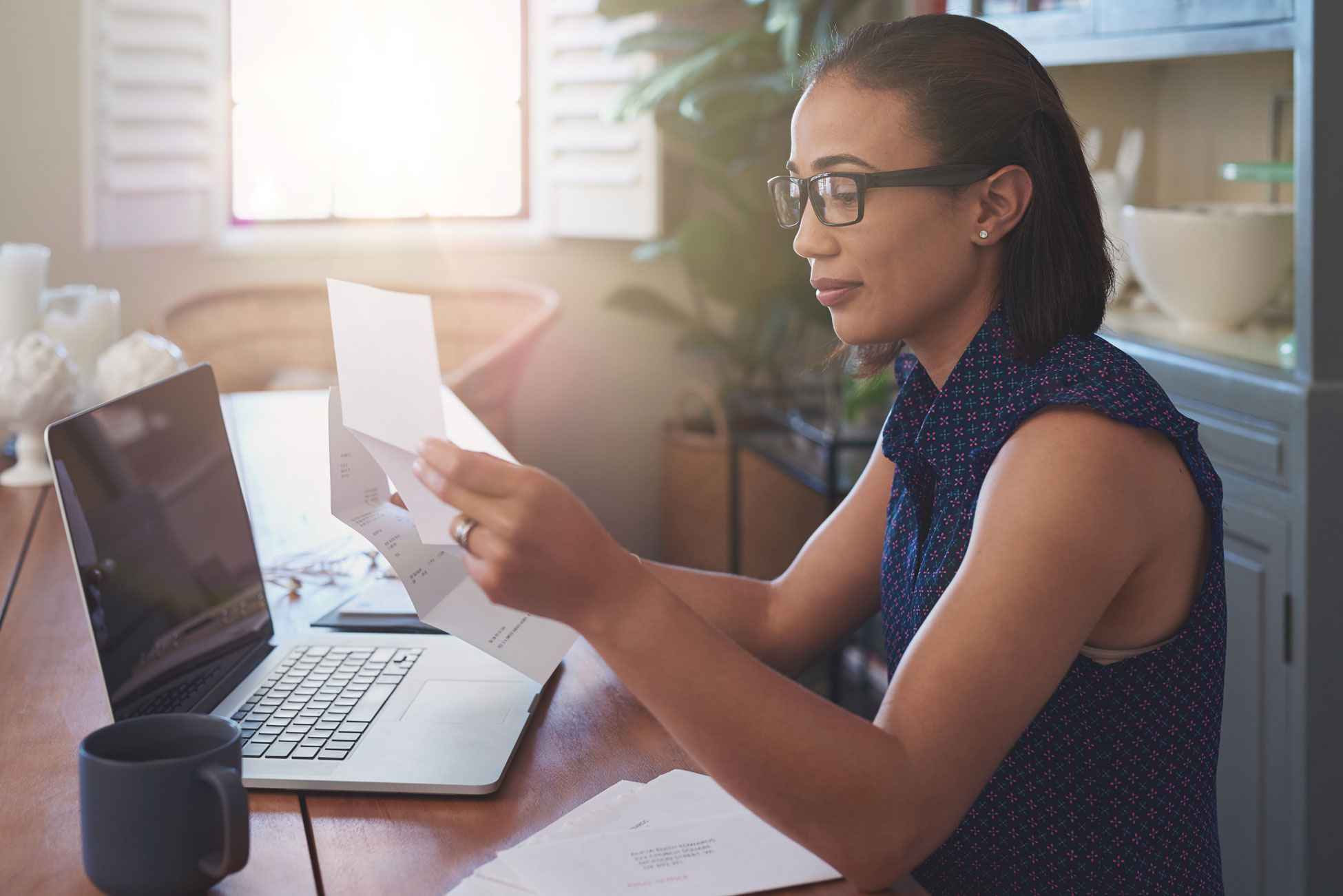 Woman Looking Over Paperwork