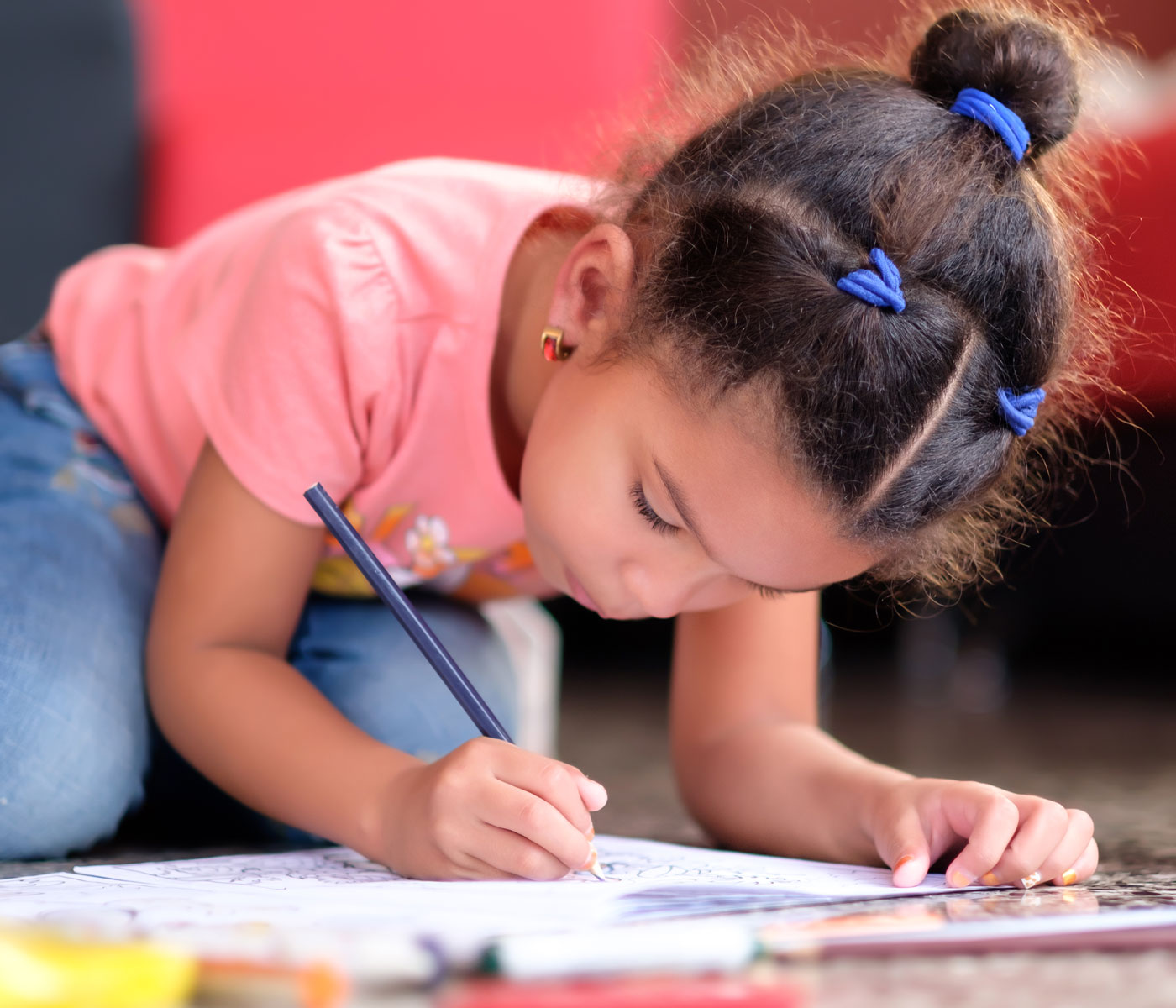 Little girl drawing very intently