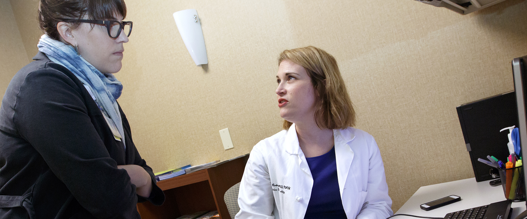 Dr. Maria Rodriguez, right, consults with resident Britta Ameel about Ameel's research