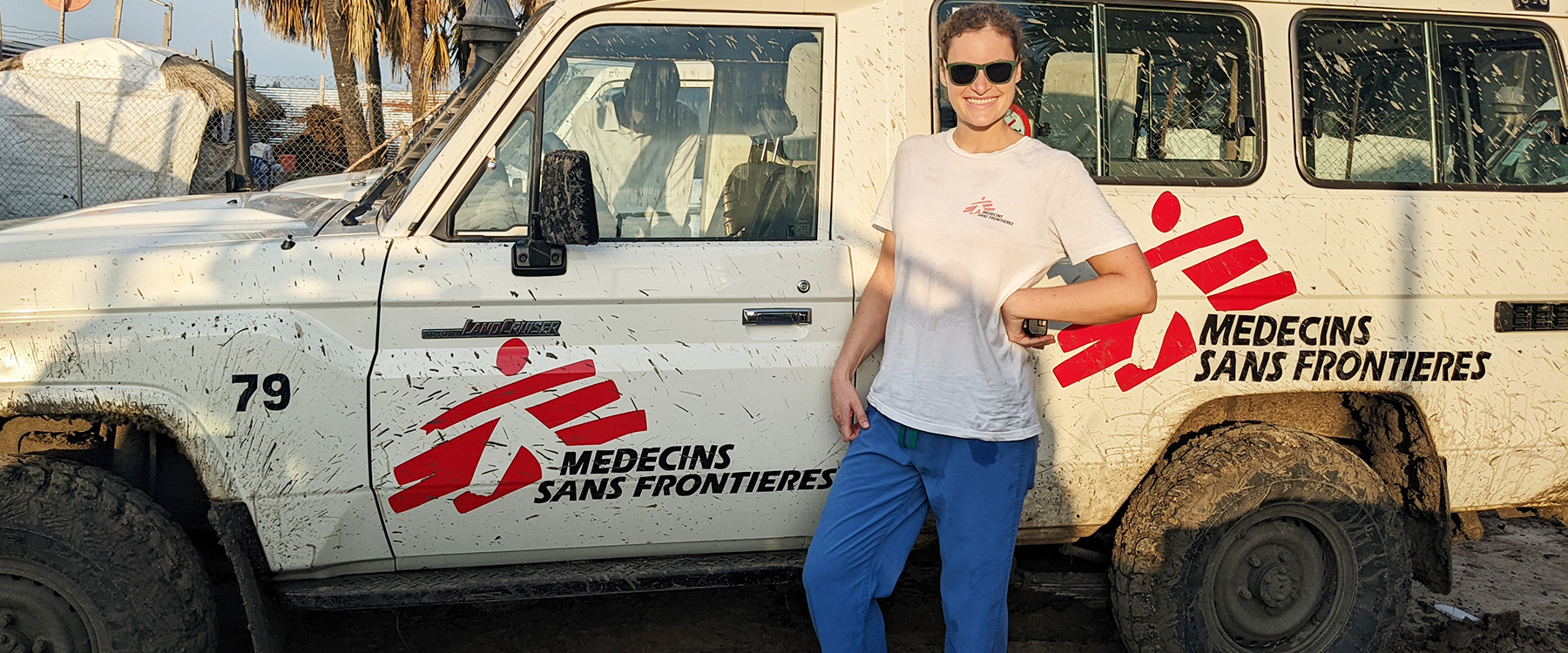 Sarah Paeth stands in front of a truck in South Sudan