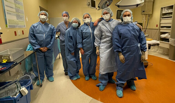 Kiara, far right, with her nursing cohort in the operating room. 
