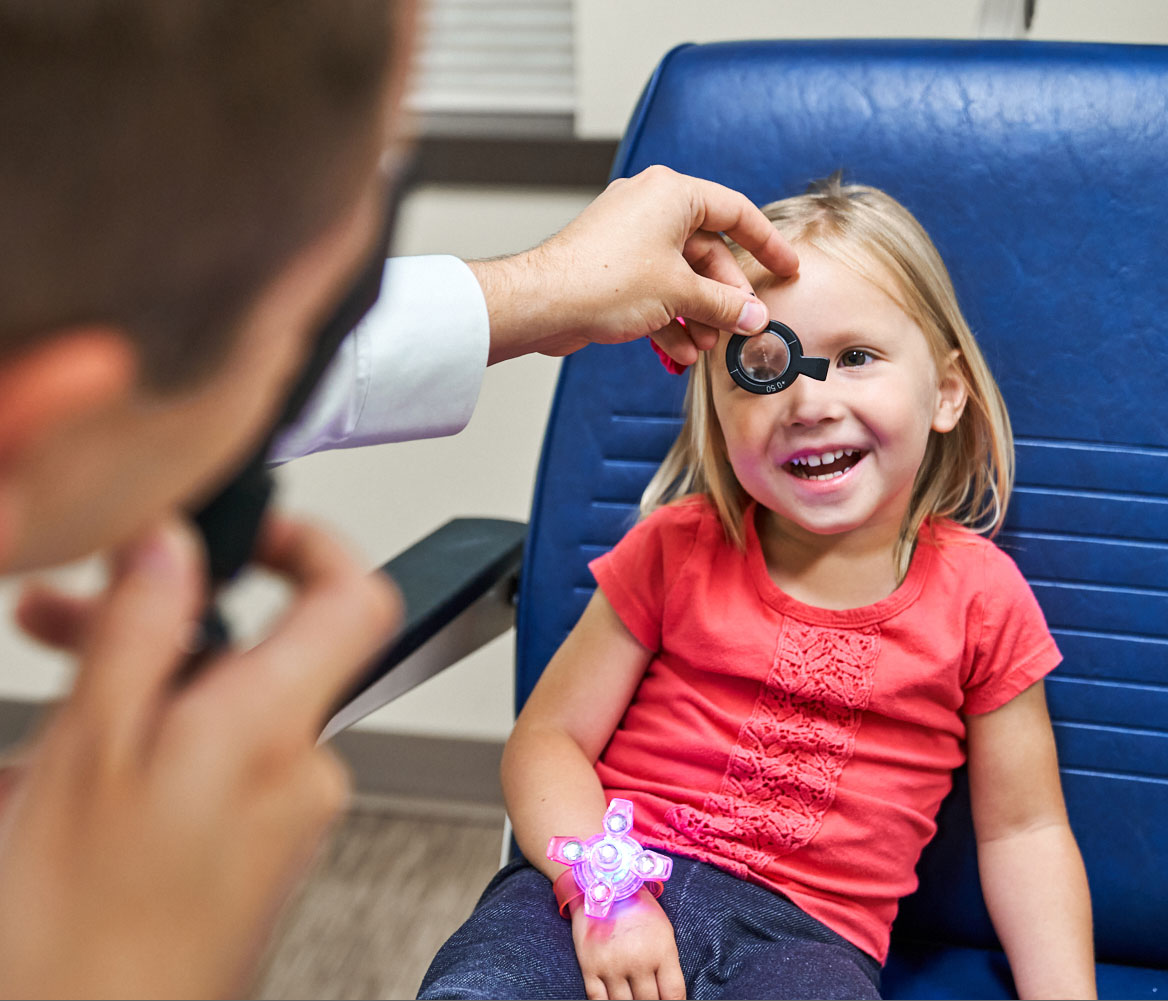 Young girl receives eye exam