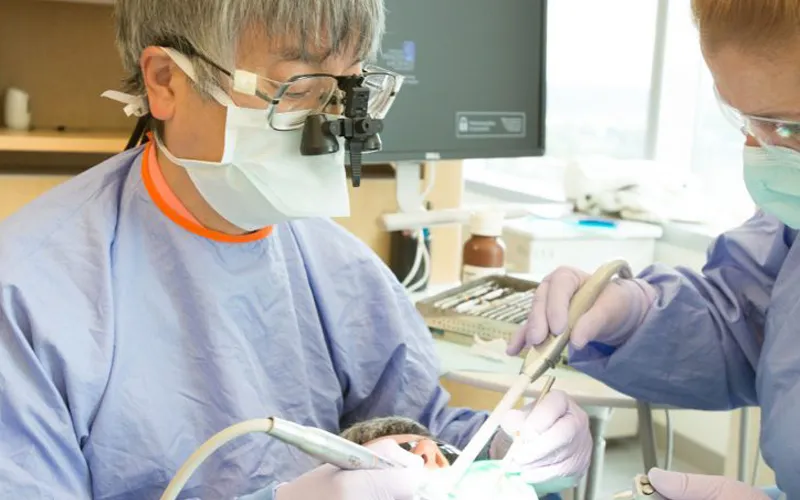 Dentist and assistant doing a procedure on a patient