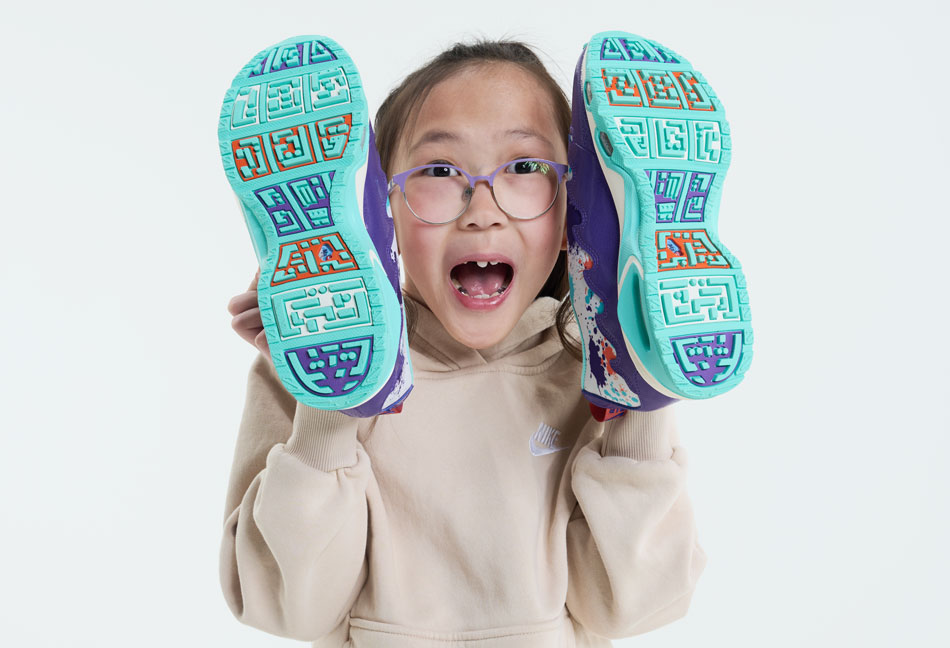 Quin shows off the soles of her Air Max SNDR's for Doernbecher Freestyle 20. 