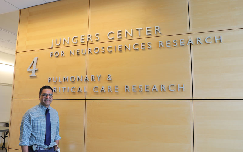Vivek Unni stands at the entrance to the Jungers Center