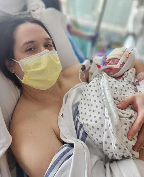 Ricki Schoepp holds her newborn child, Zack, at OHSU 
