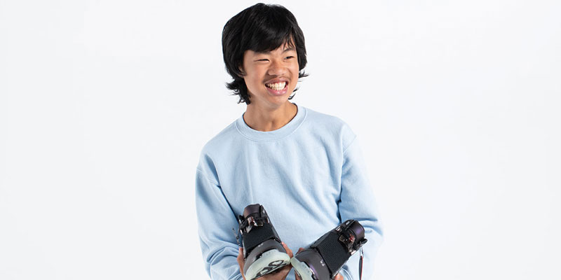 Zach holds his Freestyle shoes