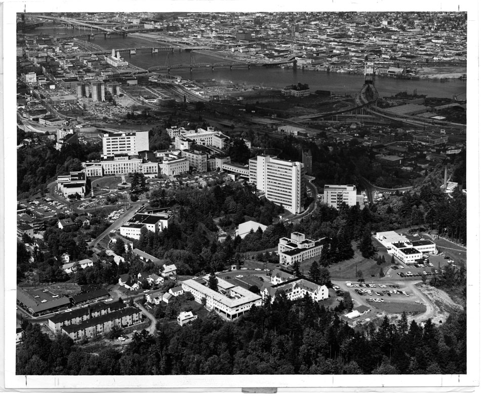 A black and white aerial photo of the 1963 OHSU Marquam Hill campus and the Willamette River running through Portland, Oregon.