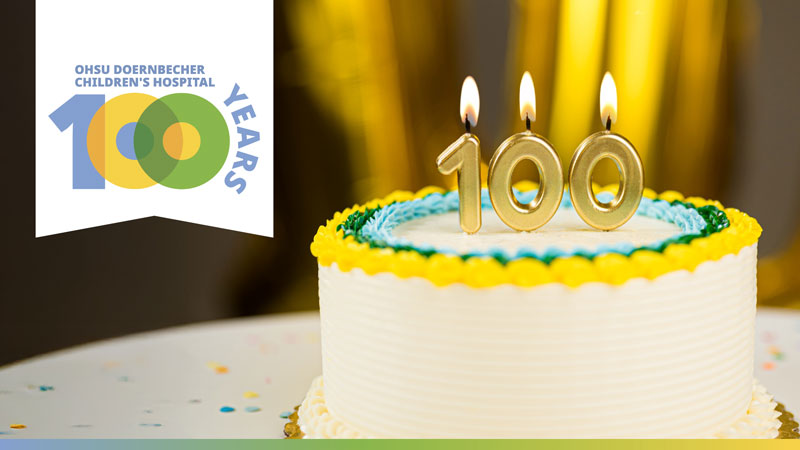 birthday cake with candles to celebrate 100 years