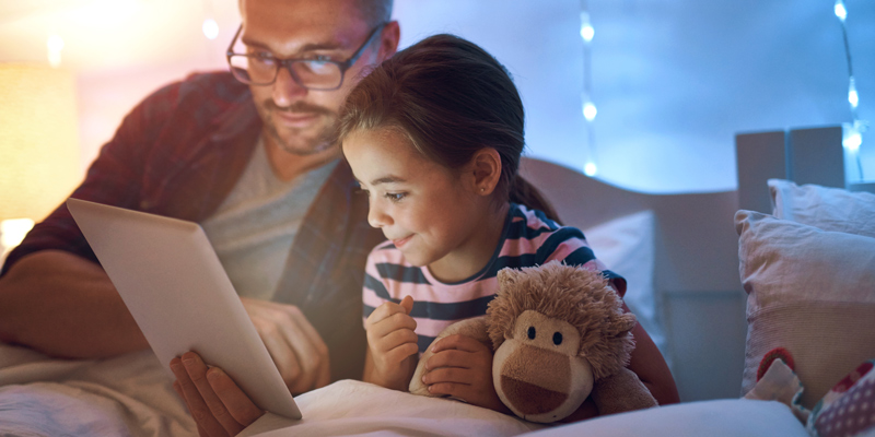 Bedtime storytelling with dad and daughter