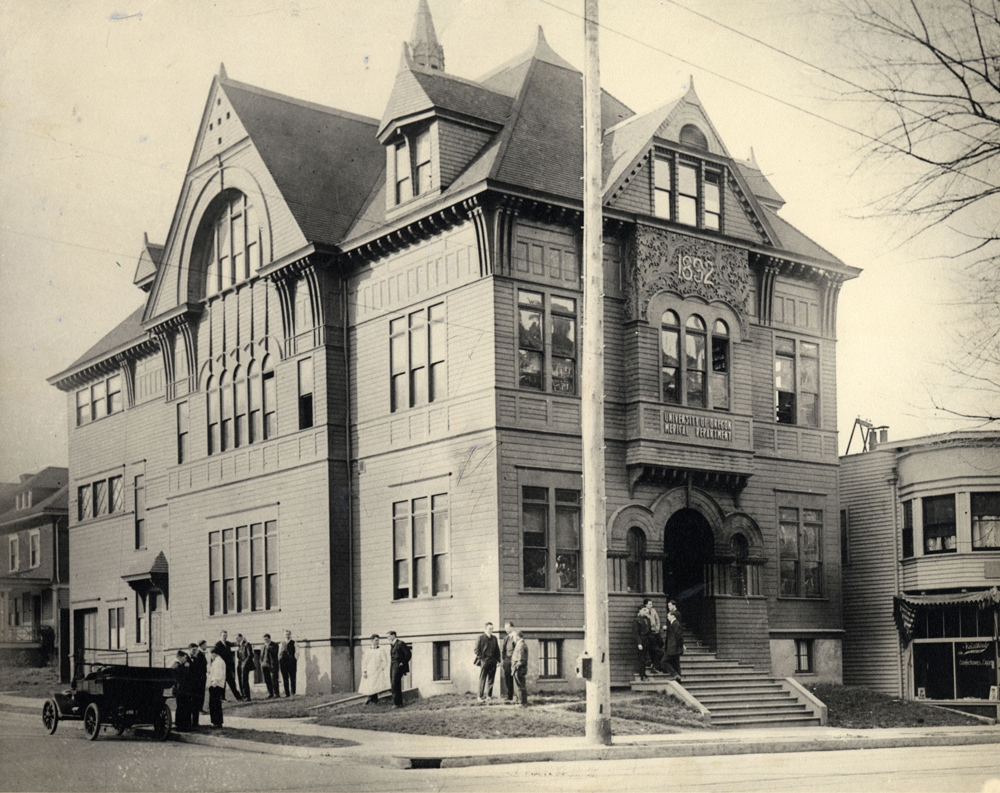 A black and white photo of a Victorian building.