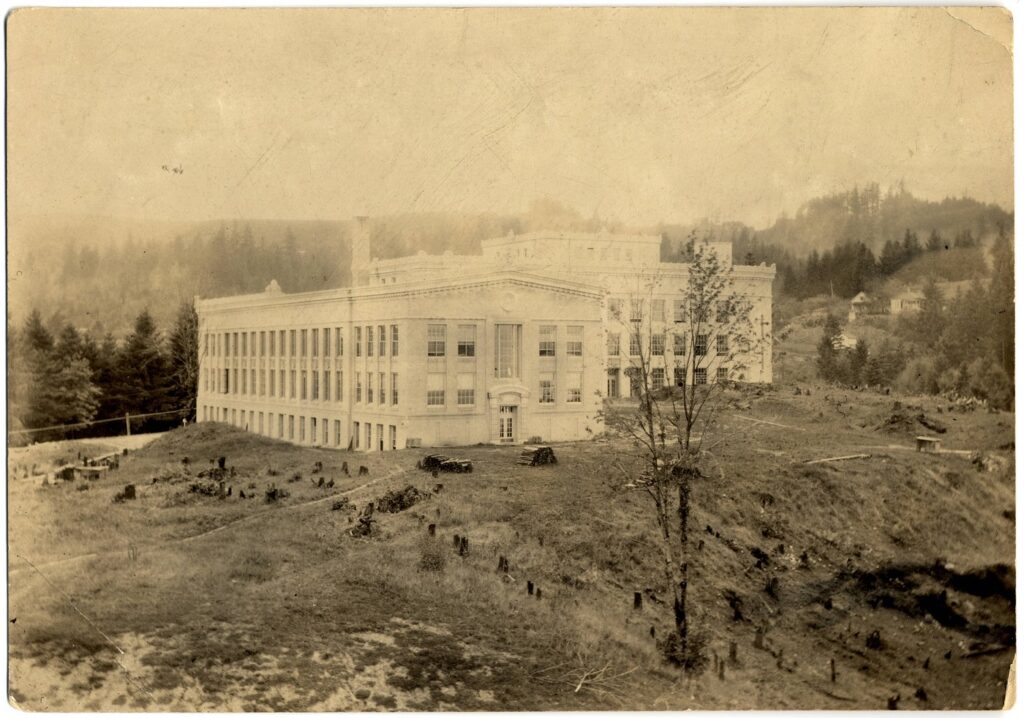 A worn black and white photo of Mackenzie Hall.